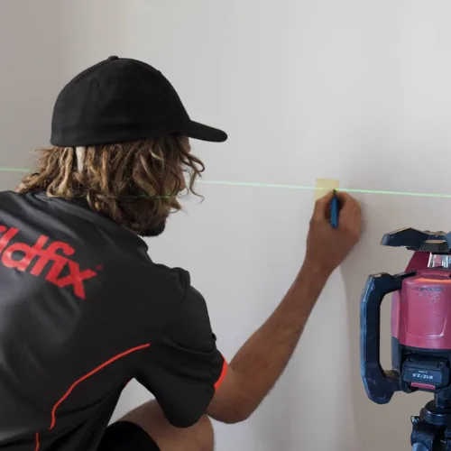 Laser monitoring equipment measuring floor re-levelling in real time during restumping alternative repair