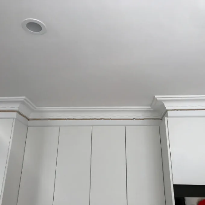 Gap opening between cornice and ceiling caused by foundation movement