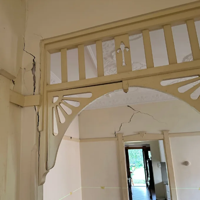 Cracks appearing on both sides of an internal archway due to foundation movement