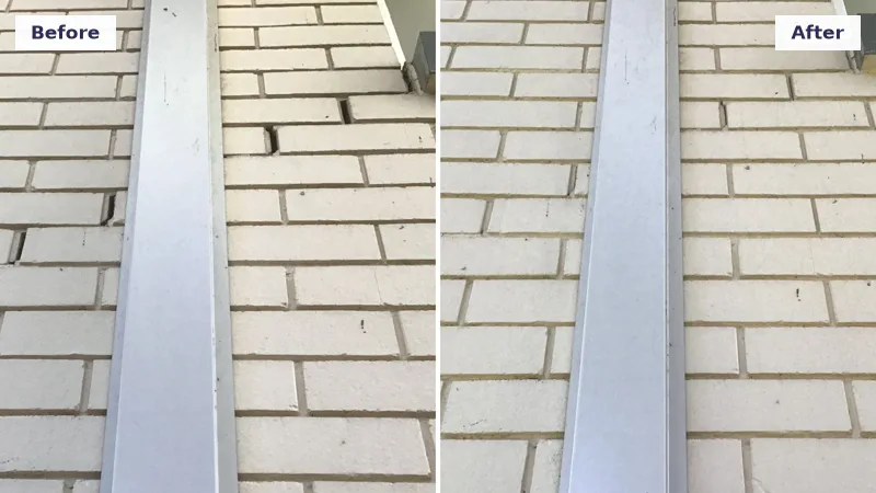Crack in a cream brick wall repaired after the foundation was relevelled